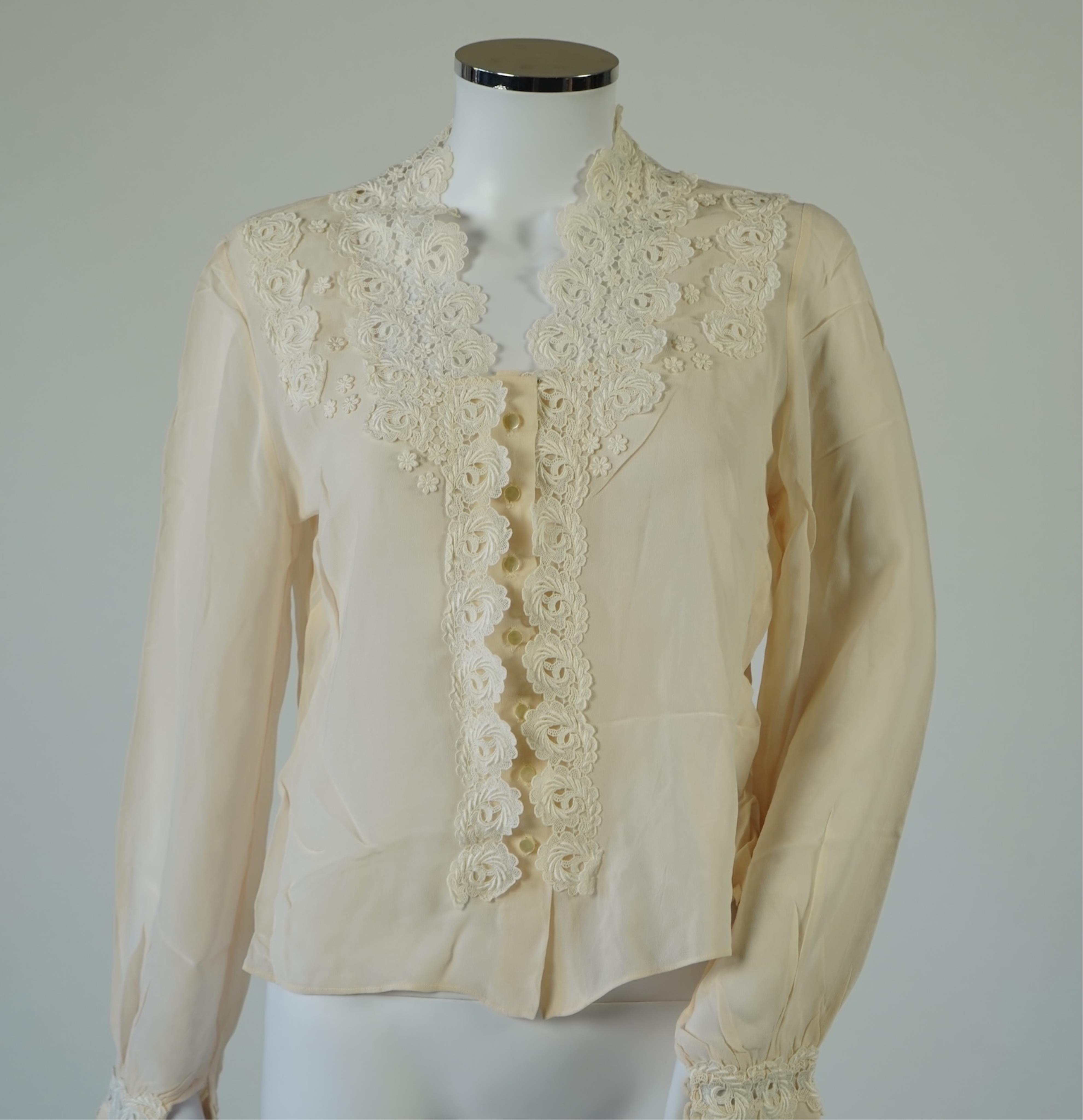 A 1940’s-50’s short sleeve lime green silk embroidered blouse, a pale pink silk crepe long sleeved blouse with white lace and a late 19th century navy silk chiffon blouse. Condition - the navy blouse is fragile but may b